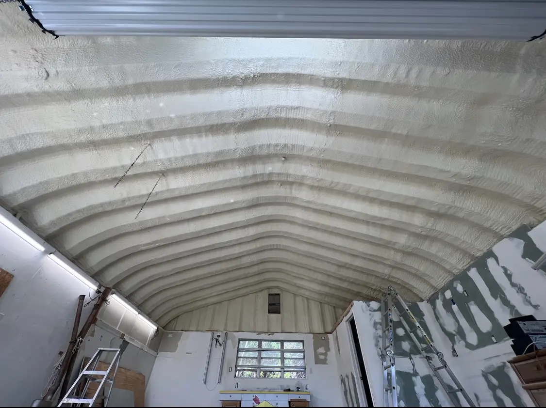 Spray polyurethane foam applied to the underside of a metal roof deck in New Prague
